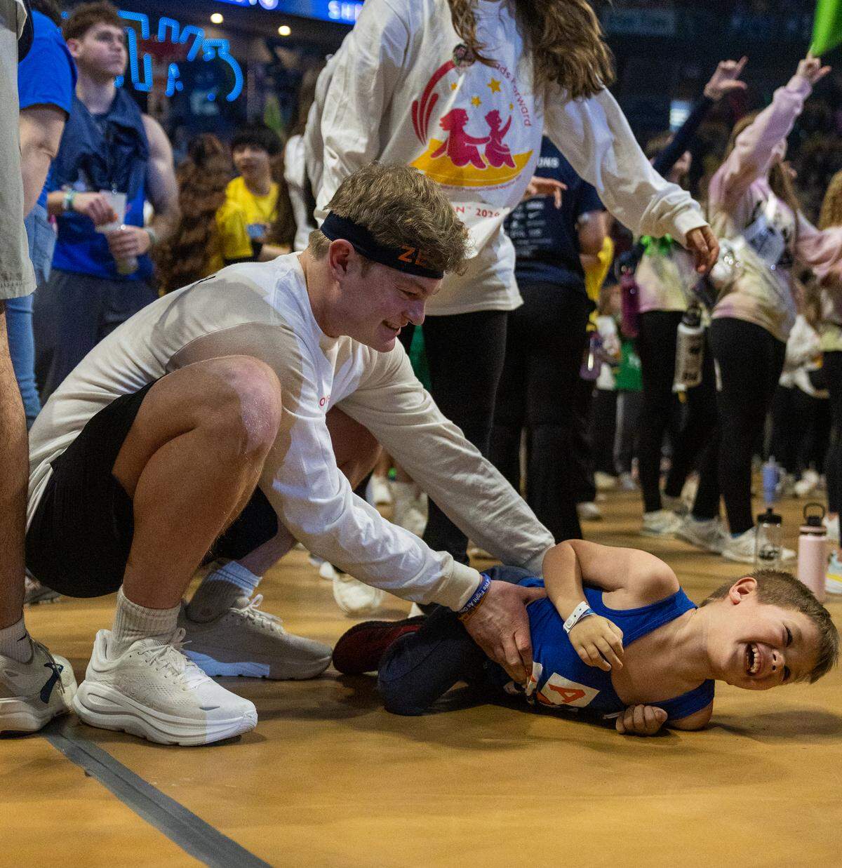 Kerrick Wille, a senior studying energy business and finance, plays with Four Diamonds child Cyrus Bomgardner during Thon on Friday, Feb. 20, 2026. Wille is a dancer for the Alpha Tau Omega fraternity.