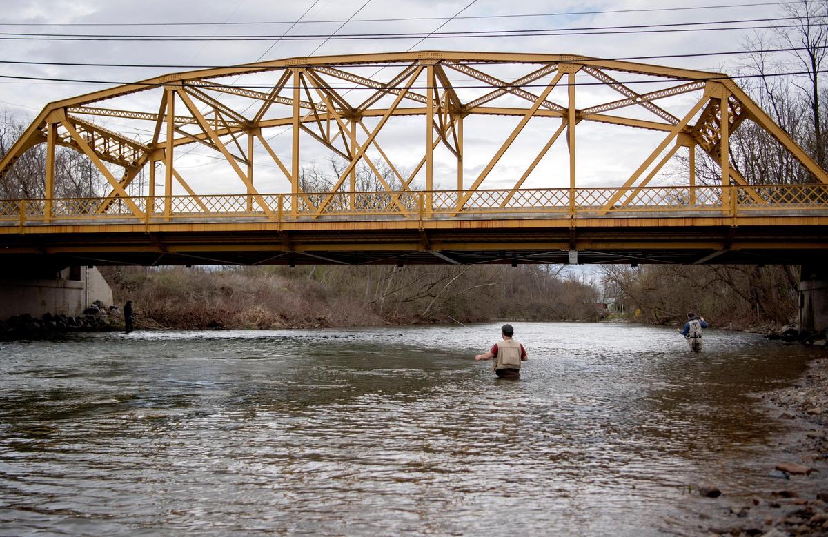 No cars cross Veterans Bridge in Milesburg as several fisherman enjoy a surprising opening day of trout fishing on Spring Creek on Tuesday, April 7, 20202. The Pennsylvania Fish and Boat Commission unexpectedly opened the trout season early on Tuesday amid the coronavirus pandemic.