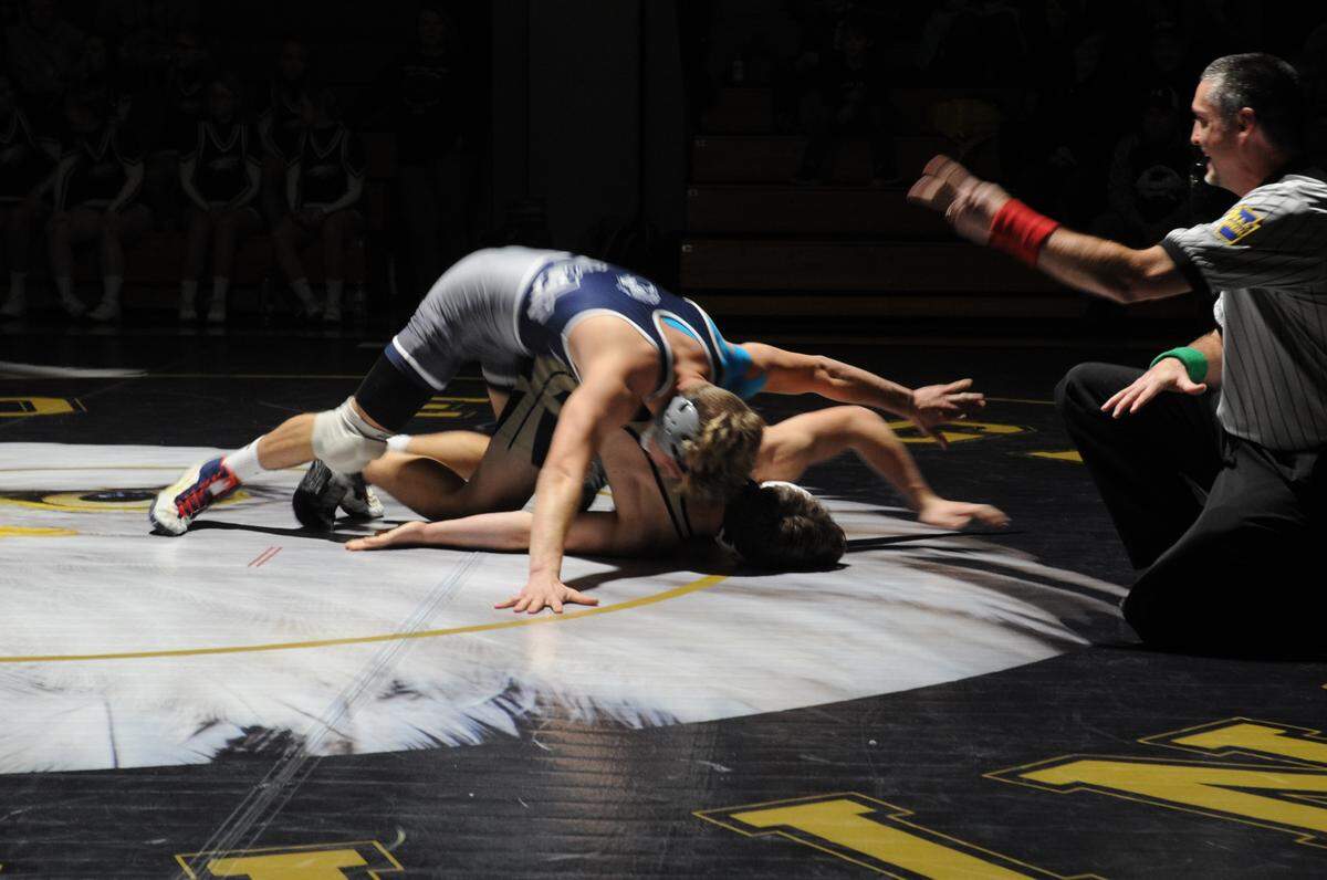 Philipsburg-Osceola’s Hunter Weitoish finishes off scoring near-fall points on Bald Eagle Area’s Matthew Knepp in their 170-pound bout during the Mounties’ 45-26 loss on Thursday. Weitoish earned a 17-2 technical fall in 3:14 over Knepp.