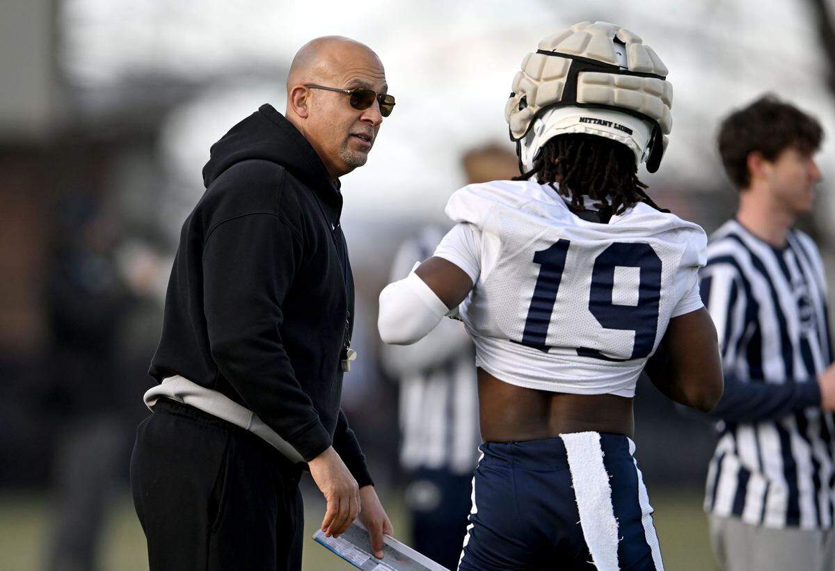 Penn State football coach James Franklin talks to wide receiver Josiah Brown during spring practice on Tuesday, March 25, 2025.