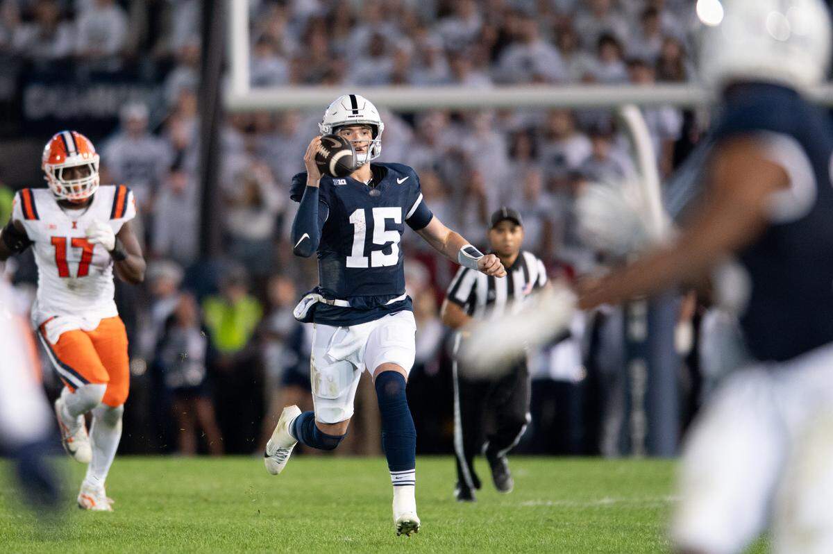 Penn State Nittany Lions quarterback Drew Allar (15) looks to pass the ball on the run during the football game against Illinois at Beaver Stadium on Saturday, Sept. 28, 2024.