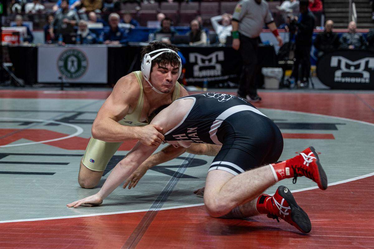 Bald Eagle Area’s Caleb Close wrestles against Faith Christian Academy’s Adam Waters in the Class 2A state title match at 189 pounds at Hershey’s Giant Center. Close fell by 11-1 major decision to earn runner-up honors.