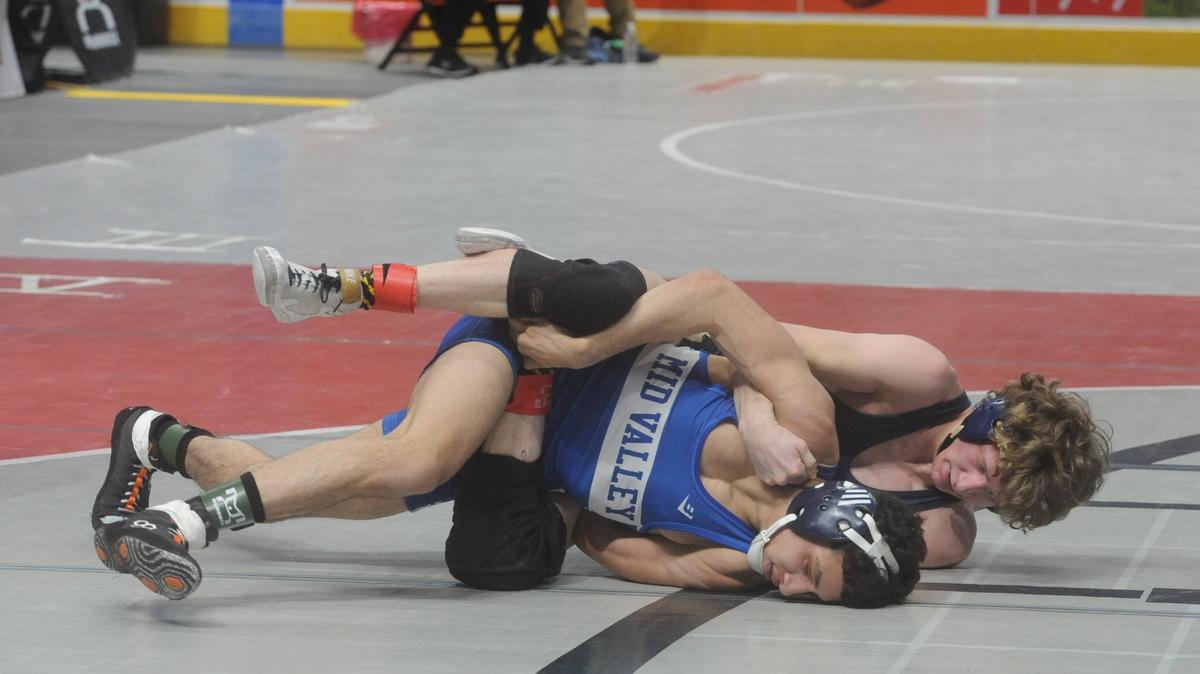 Bald Eagle Area’s Lucas Fye looks for nearfall points on Mid Valley’s Matthew Almedina in their 121-pound first round match of the PIAA Class 2A Championships on Thursday at the Giant Center. Fye beat Almedina, 6-1.
