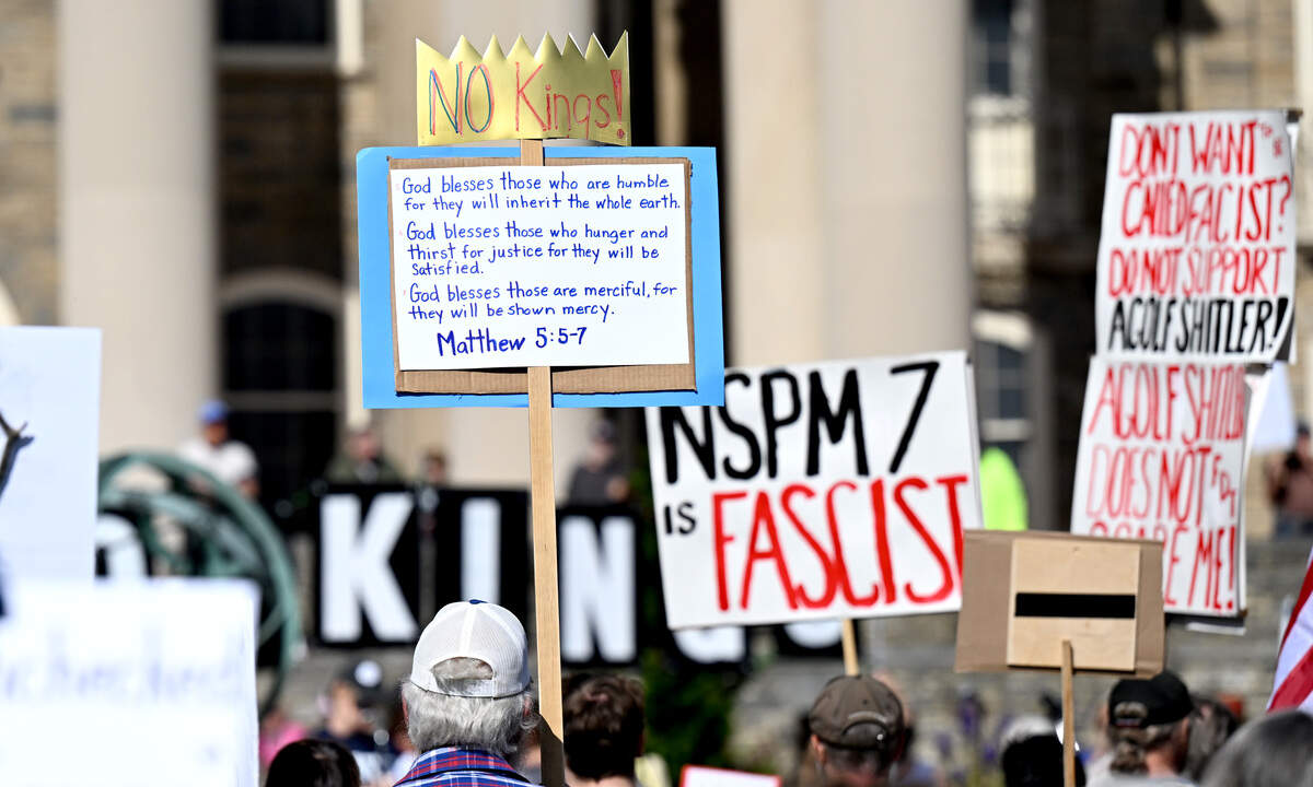 A sign with a bible verse at the No Kings anti-Trump rally on Saturday, Oct. 18, 2025.