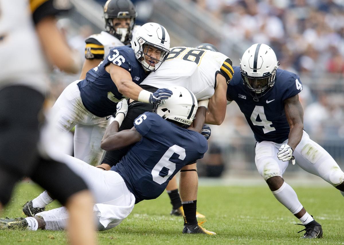Penn State linebackers Jan Johnson and Cam Brown and safety Nick Scott stop Appalachian State tight end Henry Pearson during the Saturday, Sept. 1, 2018 game at Beaver Stadium.