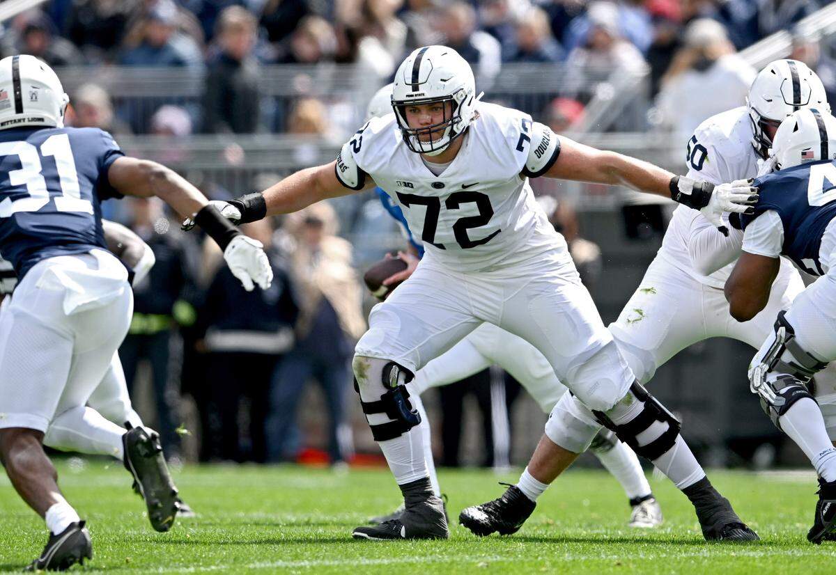 Penn State offensive lineman Nolan Rucci blocks defenders during the Blue-White game on Saturday, April 13, 2024.