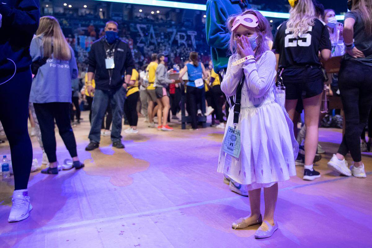 Kennedy Wilson, 6, covers her face after losing a bouncy ball during the Penn State IFC/Panhellenic Dance Marathon on Saturday at the Bryce Jordan Center.