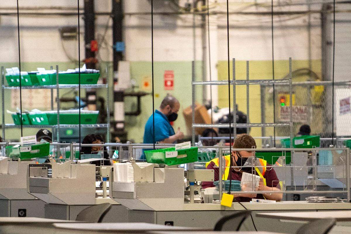 Workers count Philadelphia’s mail ballots for the May 18 primary election.