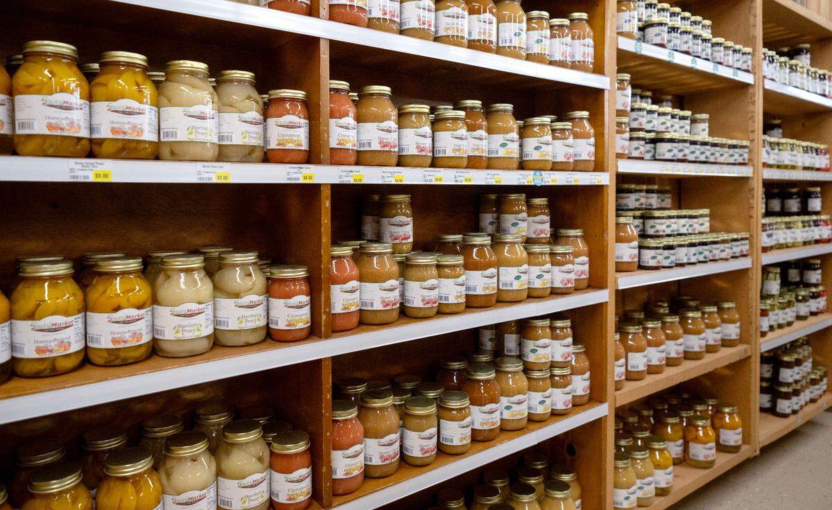 Fruits and sauces in jars line shelves at Sowers Market at 670 Tyrone Pike in Philipsburg.