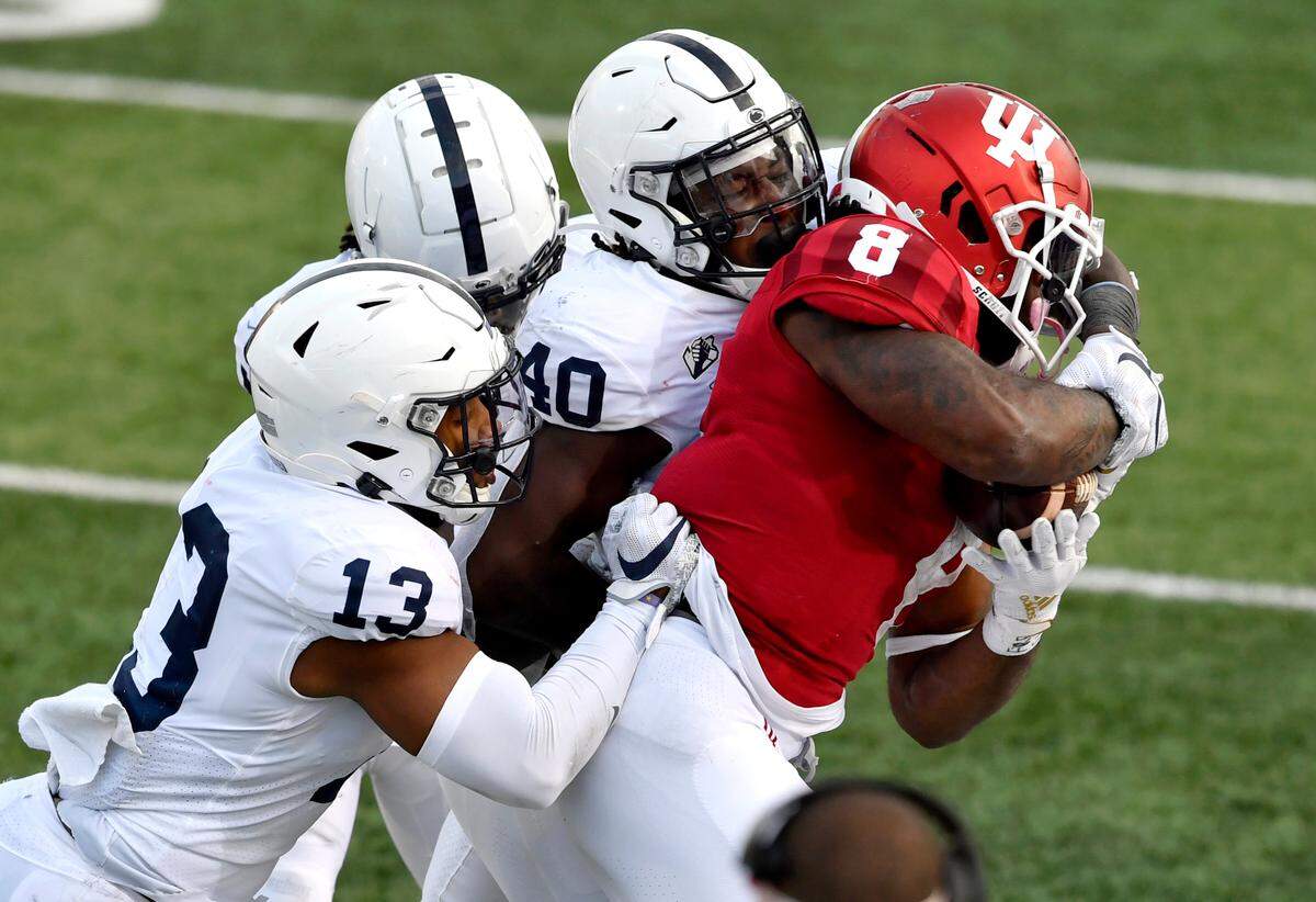 Penn State linebackers Ellis Brooks and Jesse Luketa stop Indiana’s Stevie Scott III during the game on Saturday, Oct. 24, 2020 at Memorial Stadium.