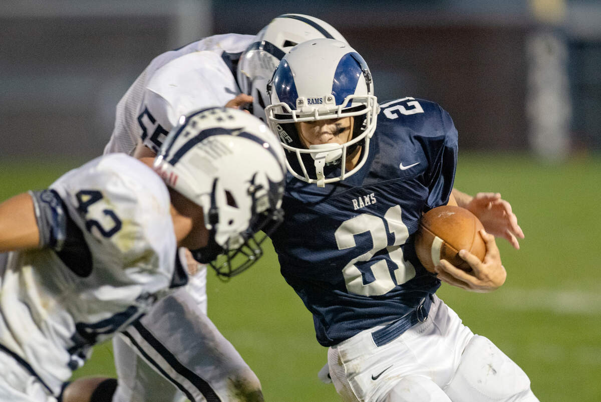 Philipsburg-Osceola defenders try to stop Penns Valley’s Ty Watson as he runs with the ball during the game on Friday, Sept. 17, 2021.