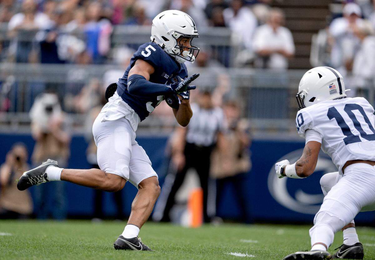 Wide receiver Omari Evans makes a catch and cut downs the field for a touchdown during the Penn State Blue-White game on Saturday, April 15, 2023.