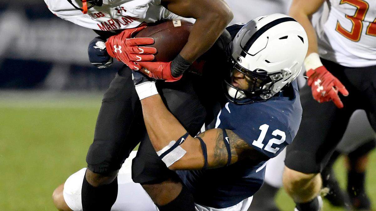 Penn State linebacker Brandon Smith pulls down Maryland’s Brian Cobbs during the game on Saturday, Nov. 7, 2020 at Beaver Stadium.