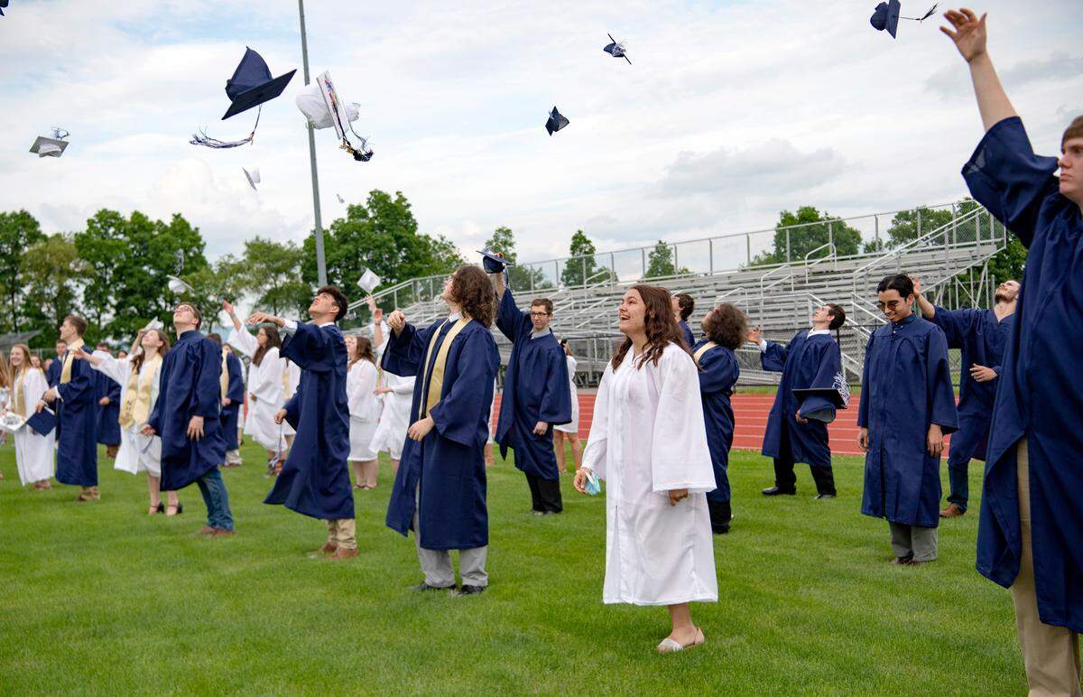 The Penns Valley class of 2020 tosses their caps at the end of a short ceremony on Friday, June, 5, 2020. Due to social gathering limits, only the graduates were allowed at the stadium for the commencement celebration. Earlier in the day each student was recognized in a drive-thru procession and received their diploma with their family.