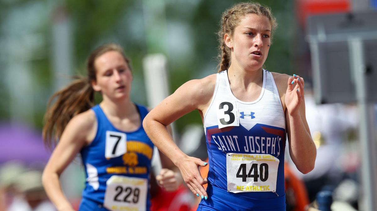 Saint Joseph’s Catholic Academy’s Kathleen Simander, right, competes in the girls’ Class 2A 800-meter run prelims during day one of the PIAA 2019 State Track & Field Championships held Friday at Shippensburg.