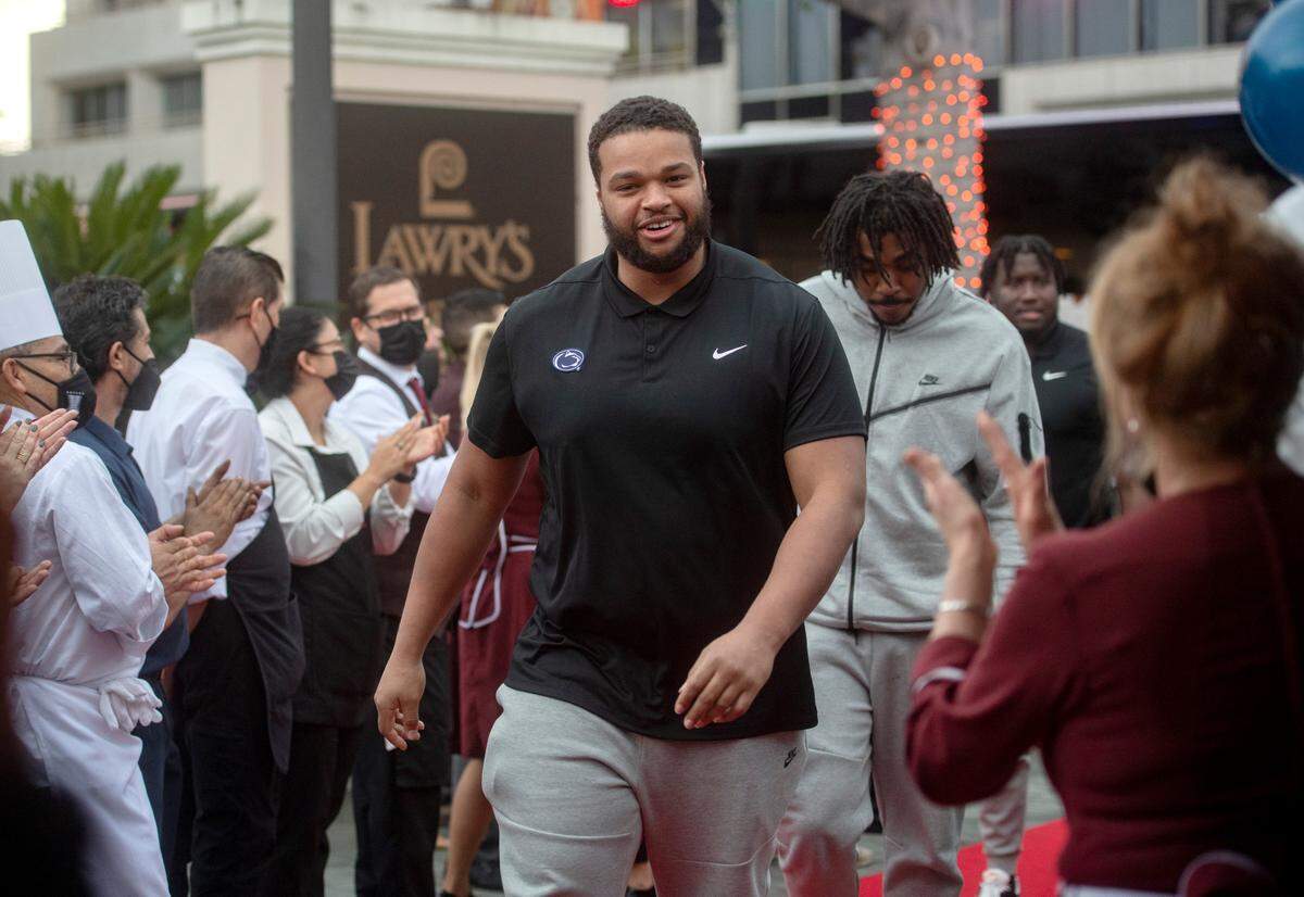 Penn State defensive tackle PJ Mustipher and his teammates are welcomed by the staff to the Lawry’s Beef Bowl on Friday, Dec. 30, 2022.