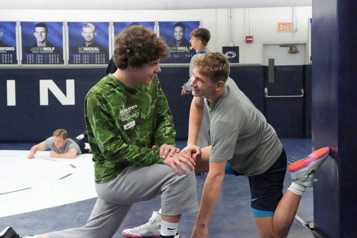 Penns Valley grad, Ty Watson, right, jokes with Penn State wrestling teammate Brock Weiss during a recent practice.