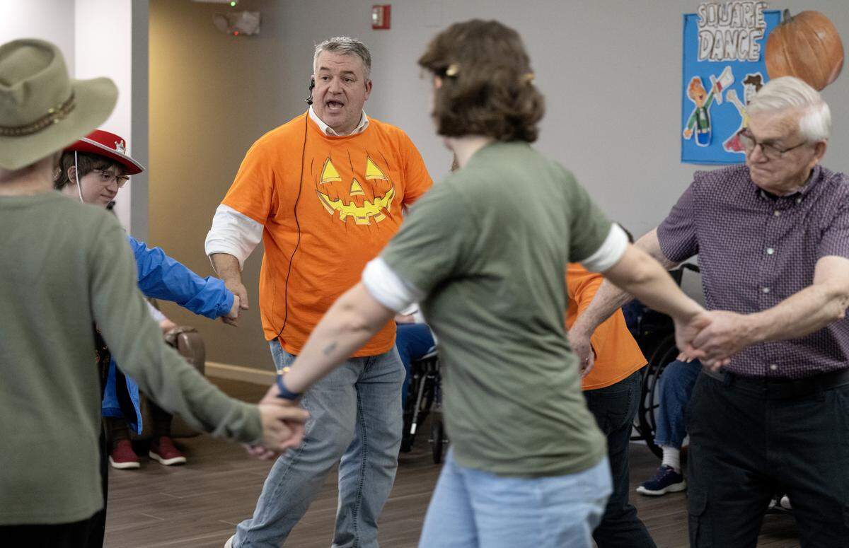 Cory Geishauser, Wynwood House Regional Activities Director, leads square dancing at the Wynwood House in Centre Hall on Thursday, Oct. 30, 2025. 