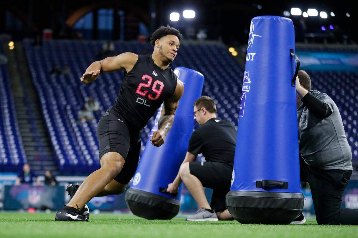 Penn State defensive lineman Yetur Gross-Matos runs a drill at the NFL football scouting combine in Indianapolis, Saturday, Feb. 29, 2020. (AP Photo/Michael Conroy)