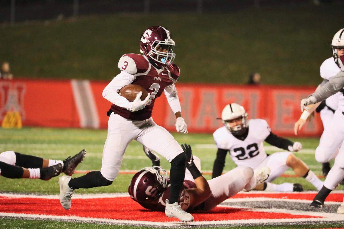 State College’s Lokey Howell runs with the ball against Delaware Valley Friday night in the first round of the PIAA football championships at Hazleton. State College won 38-7.