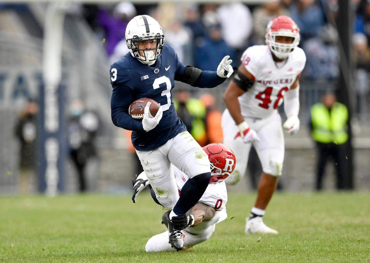 Penn State wide receiver Parker Washington runs down the field with the ball from Rutgers defensive back Christian Izien during the game on Saturday, Nov. 20, 2021.