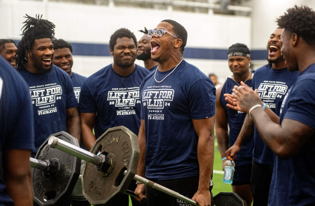 Penn State linebacker Abdul Carter celebrates winning a round of a farmers hold during the 21st Annual Lift for Life to benefit Uplifting Athletes on Thursday, June 13, 2024 in Holuba Hall.