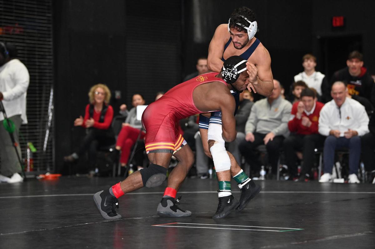 Penn State’s Shayne Van Ness fights off a shot attempt from Iowa State’s Paniro Johnson in their 149-pound bout of the Nittany Lions’ 22-12 win over the Cyclones on Tuesday, Dec. 20, 2022. Johnson edged Van Ness, 3-2.