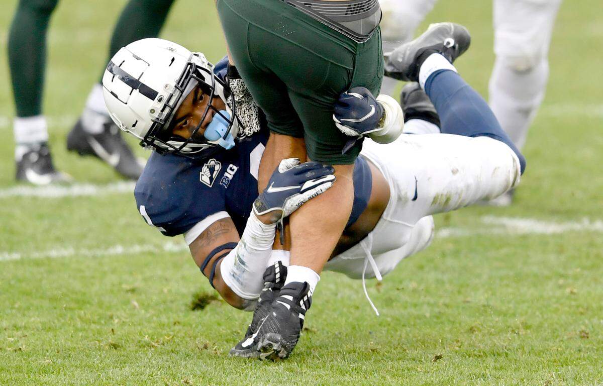 Penn State safety Jaquan Brisker stops Michigan State running back Connor Heyward during the game on Saturday, Dec. 12, 2020 at Beaver Stadium.