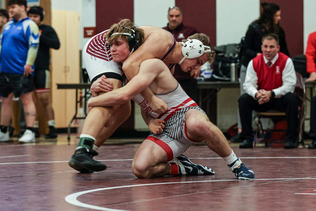 Bellefonte’s Jack McHail looks to take down Altoona’s Michael Colyer in their 215-pound finals match of the District 6 Class 3A Championships on Saturday in Altoona. Coyler edged McHail, 12-11, for the title.