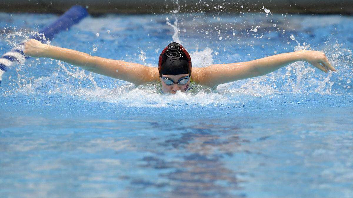 State College’s Mackenzie Pagett competes in the girls AAA 100 yard butterfly during the 2020 District 6 swimming championships.