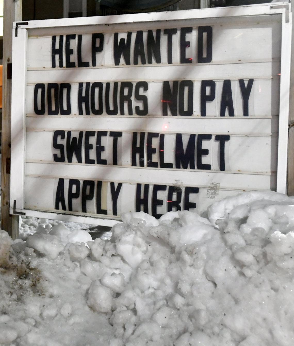 A sign outside of the Howard Fire Department reads,”Help wanted, odd hours, no pay, sweet helmet, apply here.”