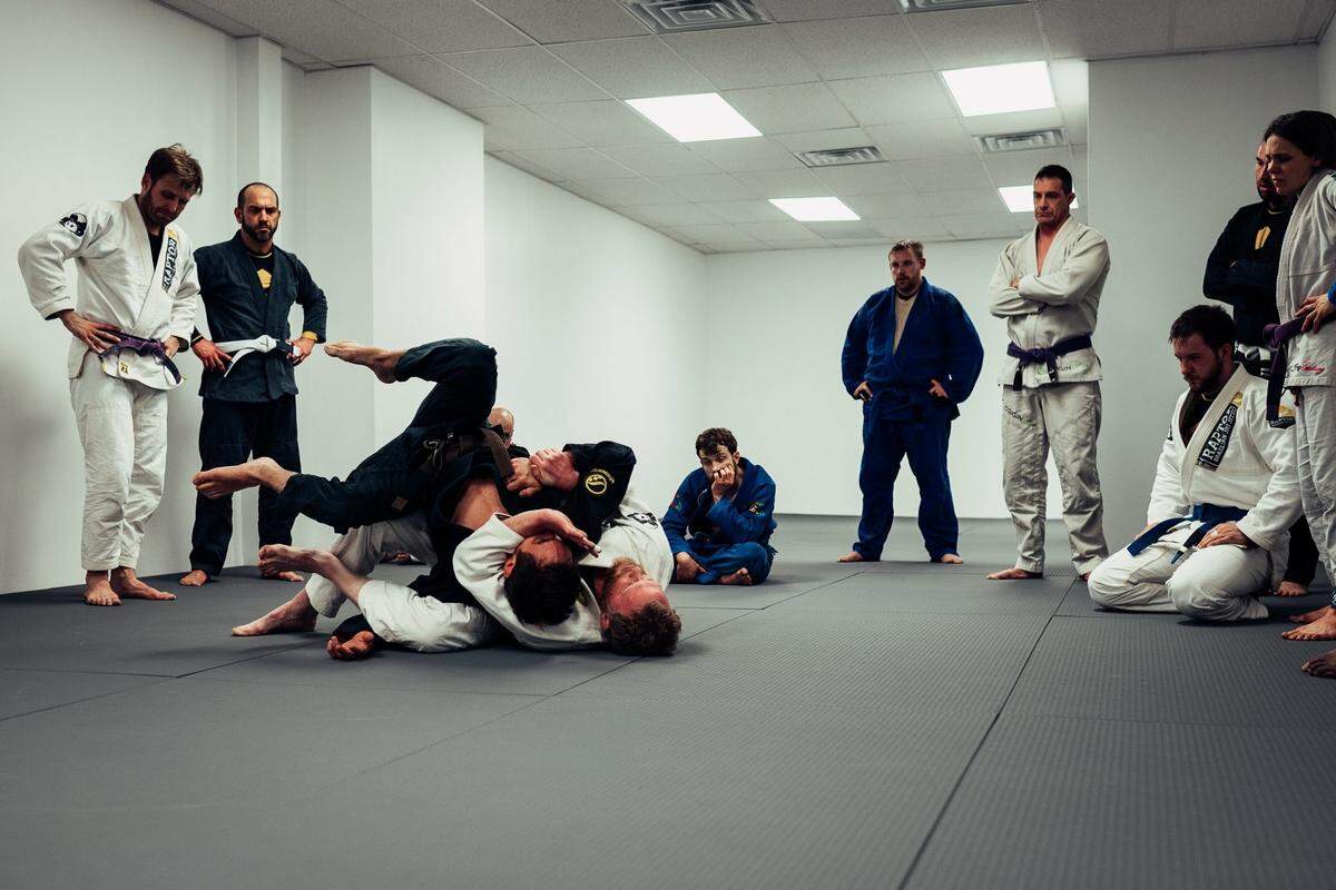 Students at Raptor Academy of Martial Arts in Bellefonte grapple during Brazilian jiu-jitsu class.