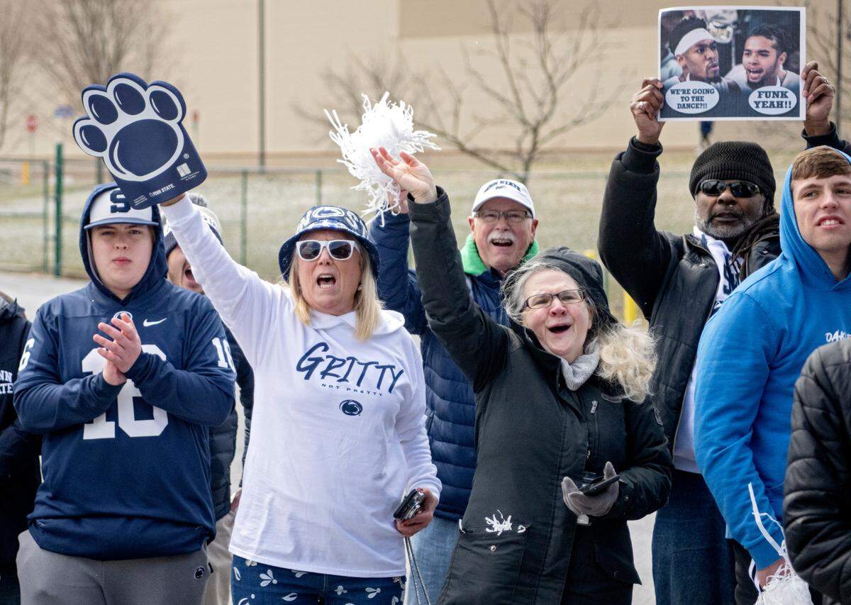 Penn State men’s basketball fans cheer on the team as they leave for the NCAA Tournament on Tuesday, March 14, 2023.