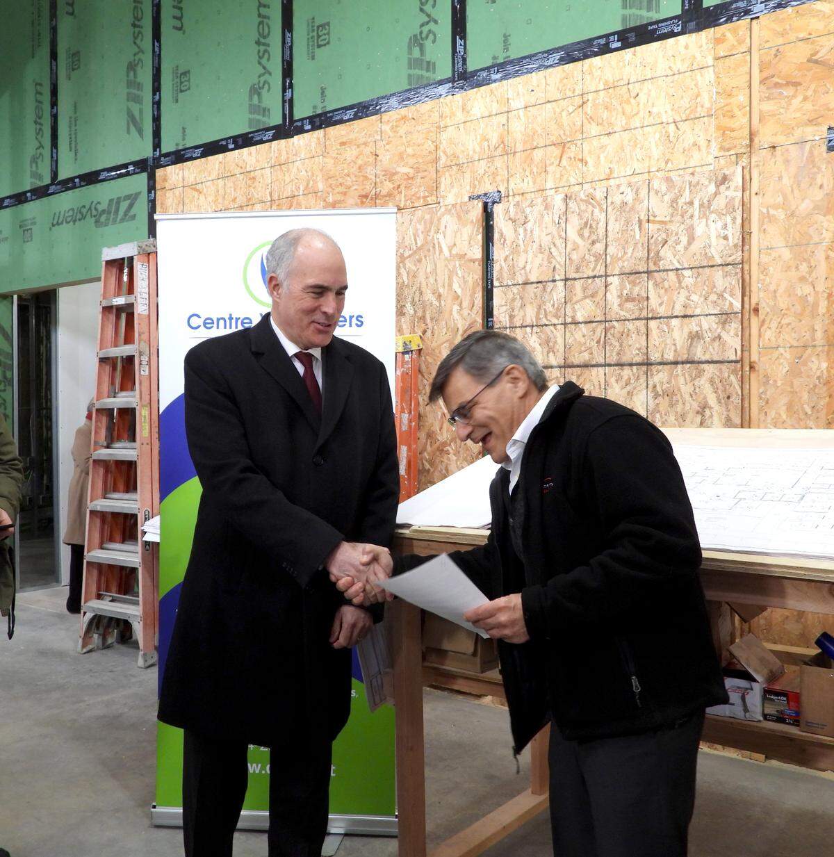 Pennsylvania Senator Bob Casey, left, shakes hands with Dr. Barry Stein, an oral surgeon, at the new Centre Volunteers in Medicine building Tuesday.