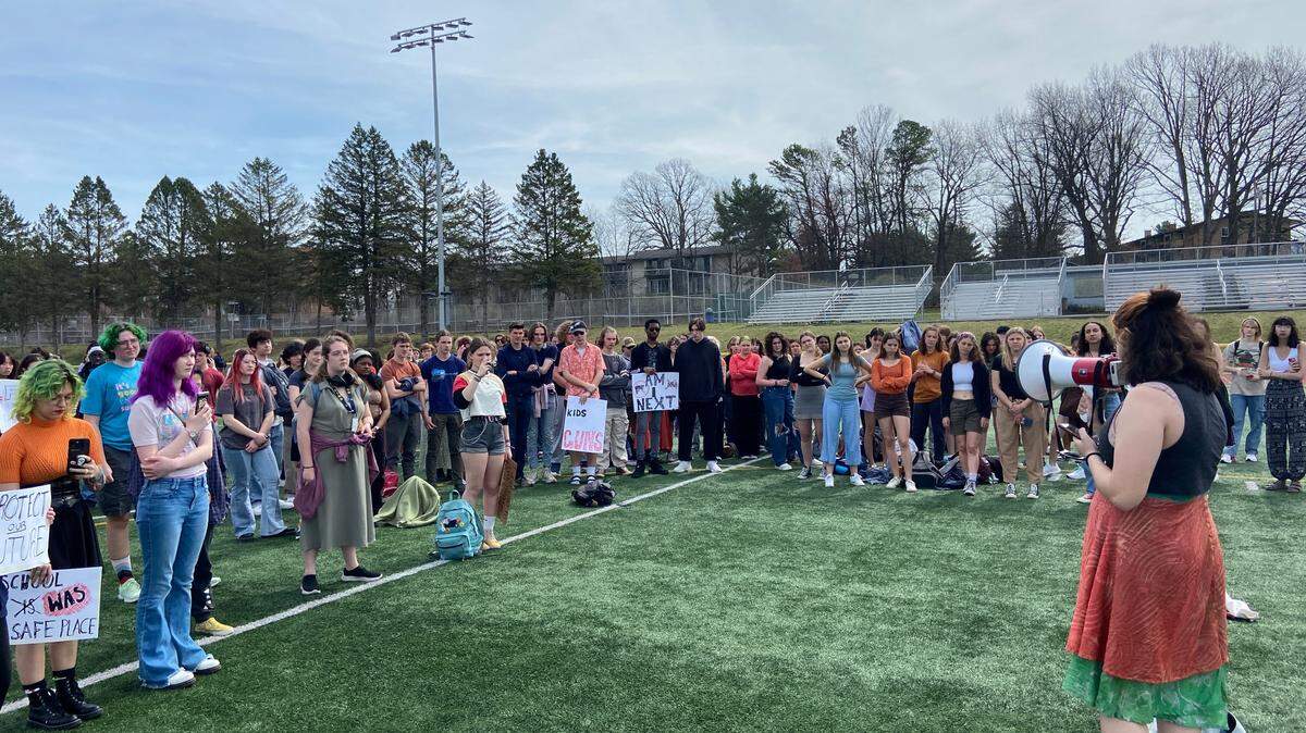 Mia High, a senior, reads a list of 13 schools that have experienced gun-related injuries or deaths in 2023 as part of national walkout at State High on Wednesday, April 5, 2023