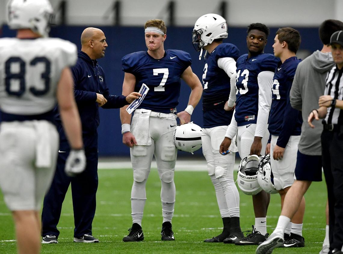 Penn State football coach James Franklin talks to  quarterbacks Will Levis and Tommy Stevens after Levis was pressured and lost the ball during spring practice on Wednesday, April 3, 2019 in Holuba Hall.