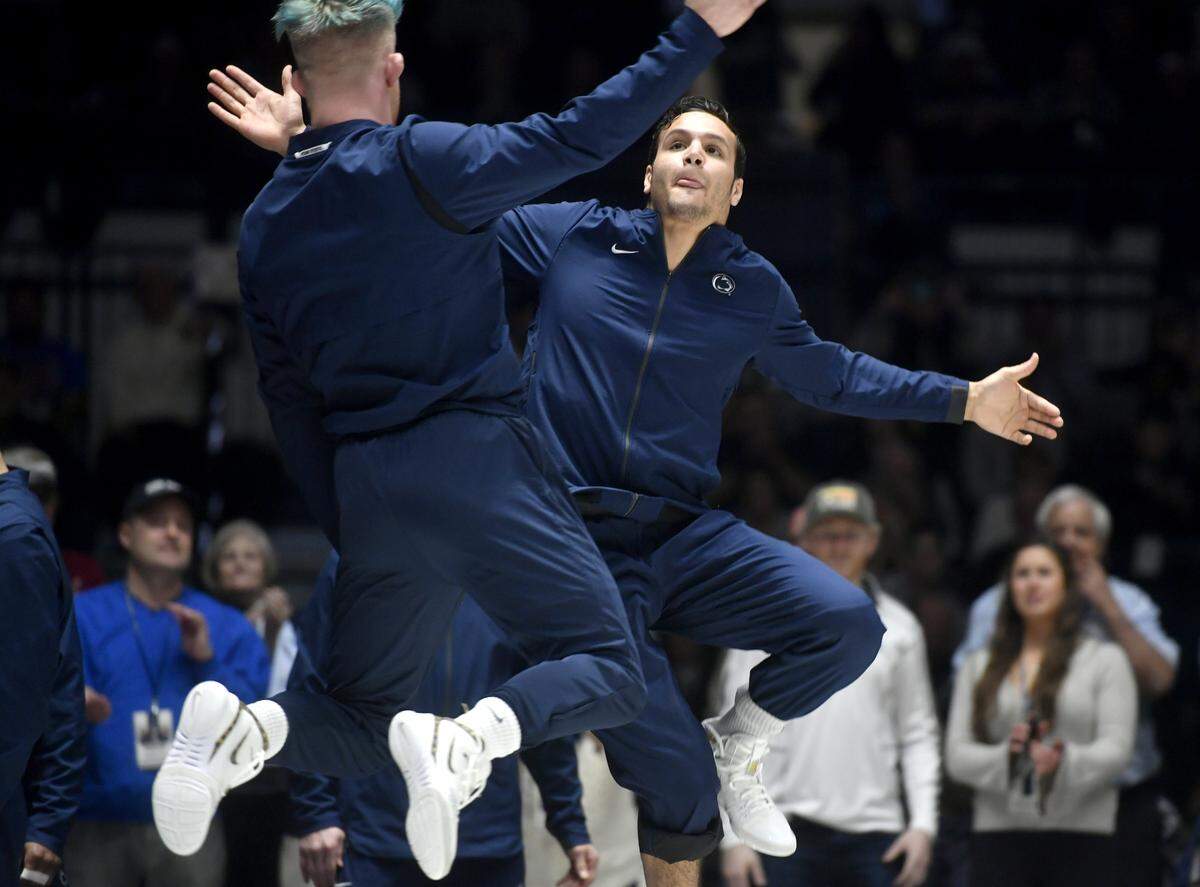 Penn State wrestlers Bo Nickal and Shakur Rasheed jump to high-five before the match against Michigan State on Friday, Feb. 15, 2019 at Rec Hall.