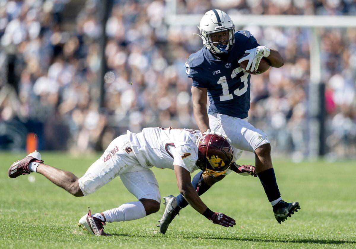 Central Michigan’s Donte Kent tries to stop Penn State running back Kaytron Allen during the game on Saturday, Sept. 24, 2022.