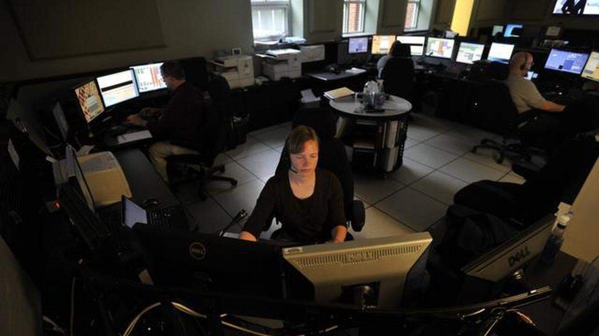 Dispatchers work in the Centre County communications center in Bellefonte in 2014.