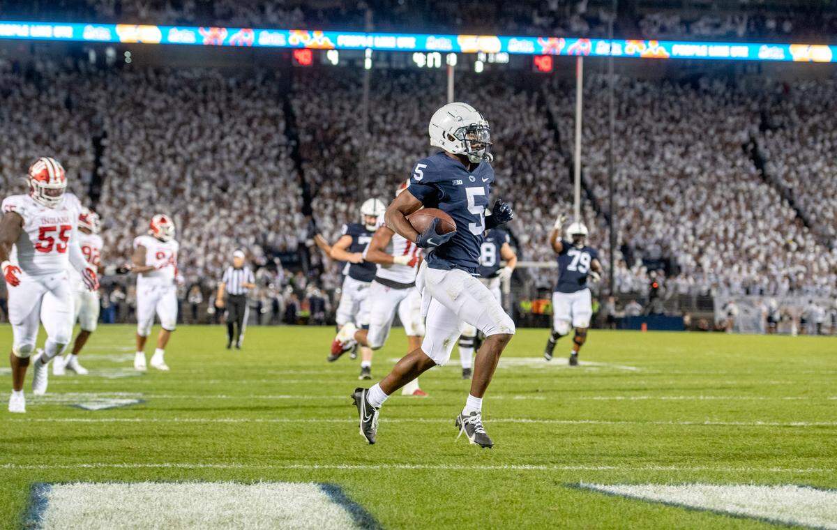 Penn State wide receiver Jahan Dotson jogs into the end zone ahead of Indiana defenders.