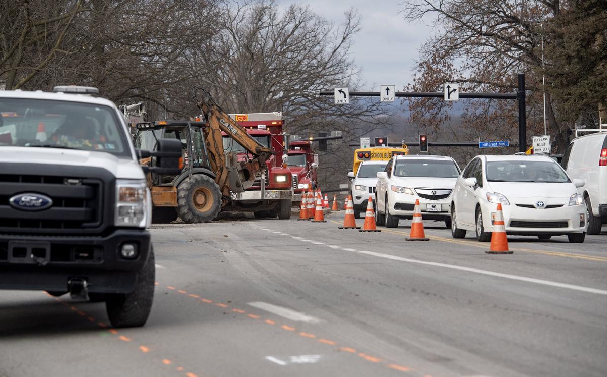 Construction causes slow moving single lane traffic in both directions on North Atherton Street near Hillcrest Avenue on Dec. 5, 2018.