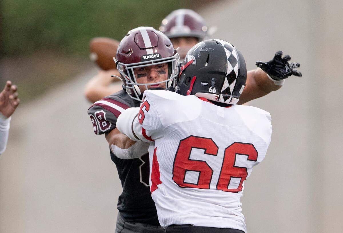 State College’s Stephen Scourtis blocks Williamsport’s Joshua Lake during the game on Friday, Aug. 26, 2022 at Memorial Field.