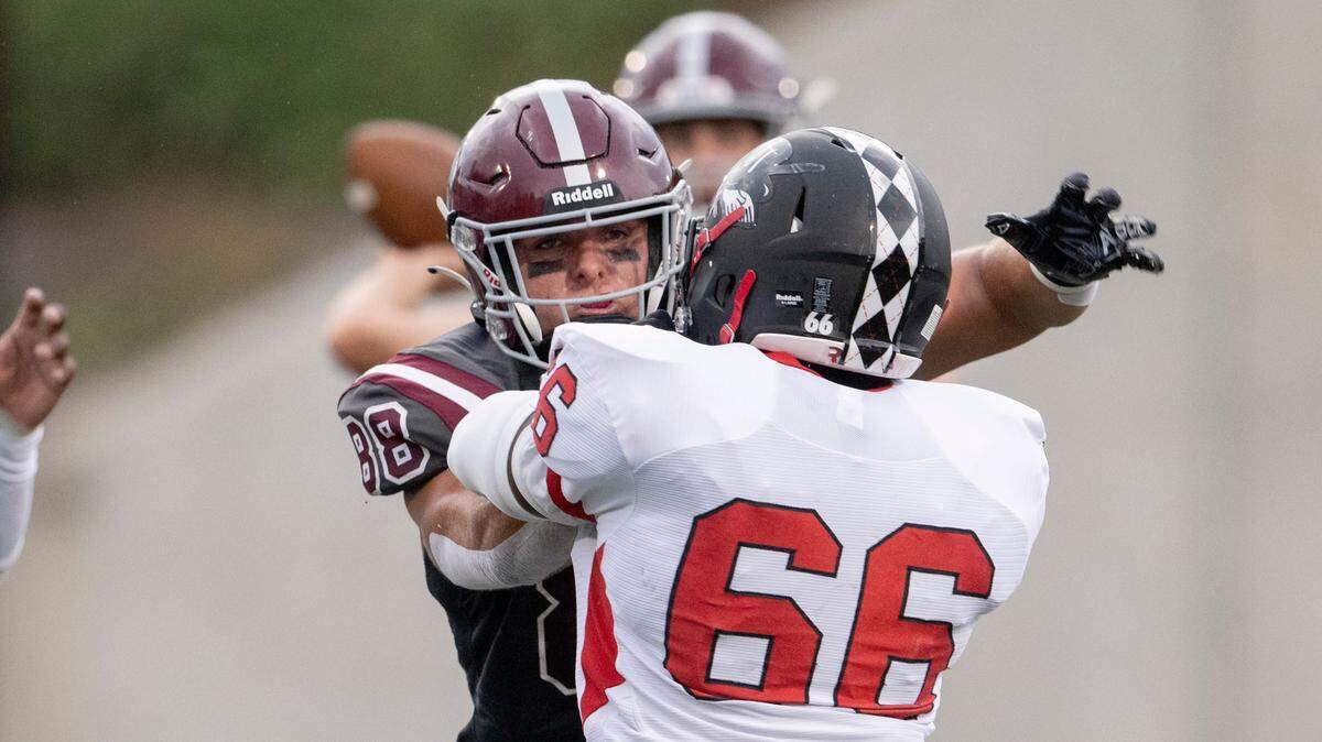 State College’s Stephen Scourtis blocks Williamsport’s Joshua Lake during the game on Friday, Aug. 26, 2022 at Memorial Field.