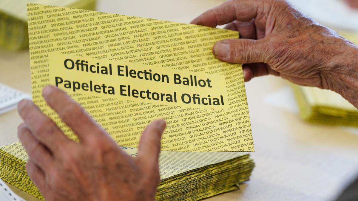 Workers sort mail ballots on primary Election Day 2024 at Northampton County Courthouse in Easton, Pennsylvania.