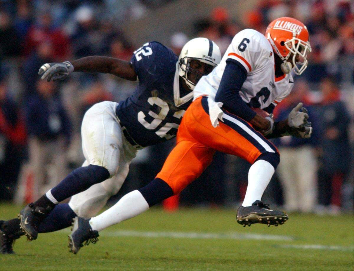 Penn State’s Bryan Scott (32) prepares to tackle Illinois’ Brandon Lloyd (6), Saturday, Nov. 2, 2002.