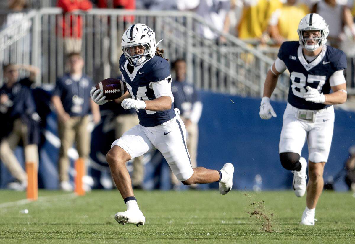 Penn State running back Corey Smith runs with the ball during the game on Saturday, Oct. 11, 2025.
