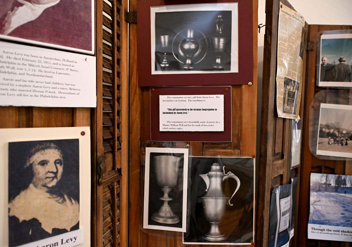 Photos of the communion set that was gifted from Aaron Levy to the Lutheran Church that is the start of the Aaronsburg Story on display at the Penns Valley Area Historical Museum.