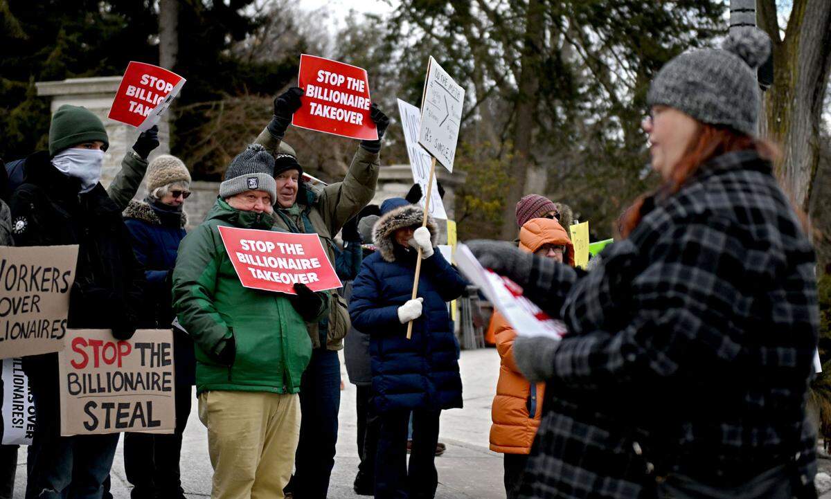 Community members rally support for working families on Friday, Feb. 21, 2025 at the Allen Street gates.
