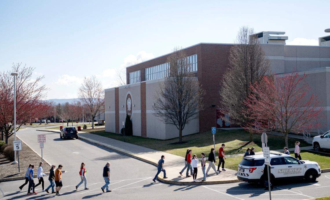 A group of students are escorted to be released after a threat at the Bellefonte Area High School on Wednesday, March 29, 2023.