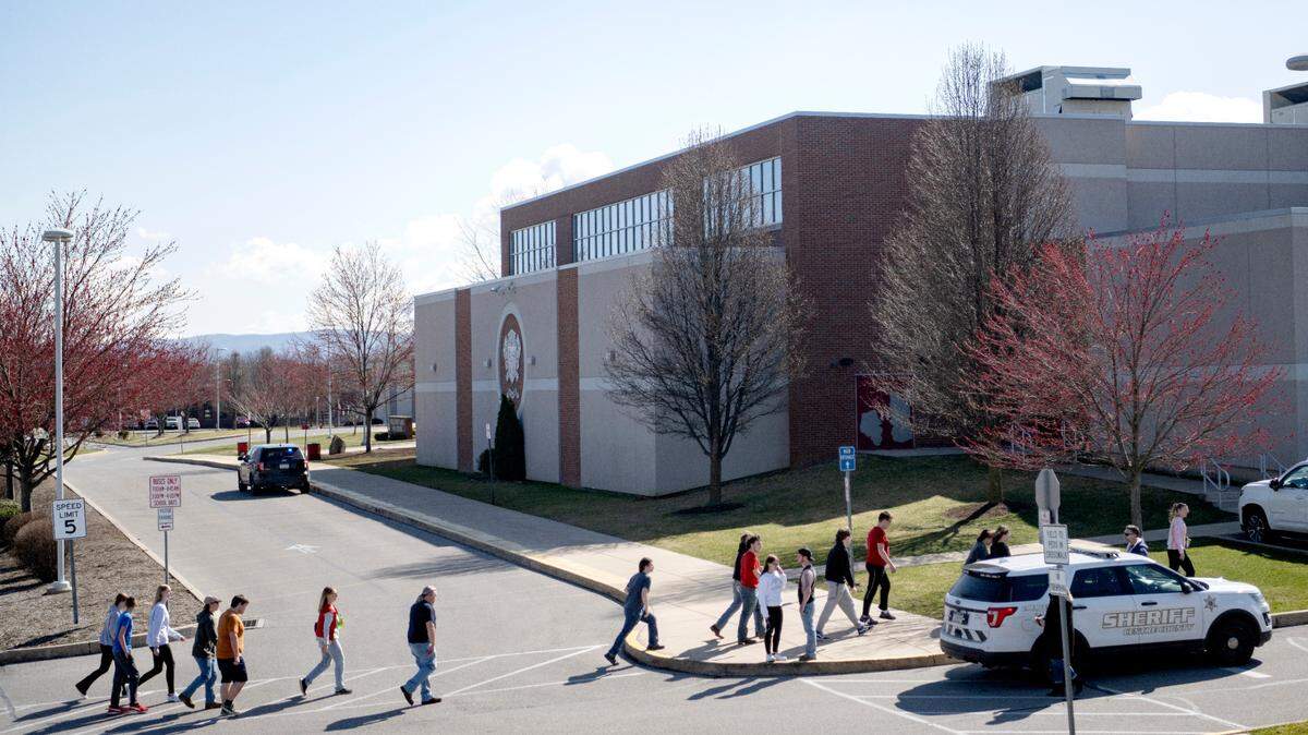 A group of students are escorted to be released after a threat at the Bellefonte Area High School on Wednesday, March 29, 2023. One Bellefonte Area official recently said the addition of metal detectors could prove useful in similar situations.
